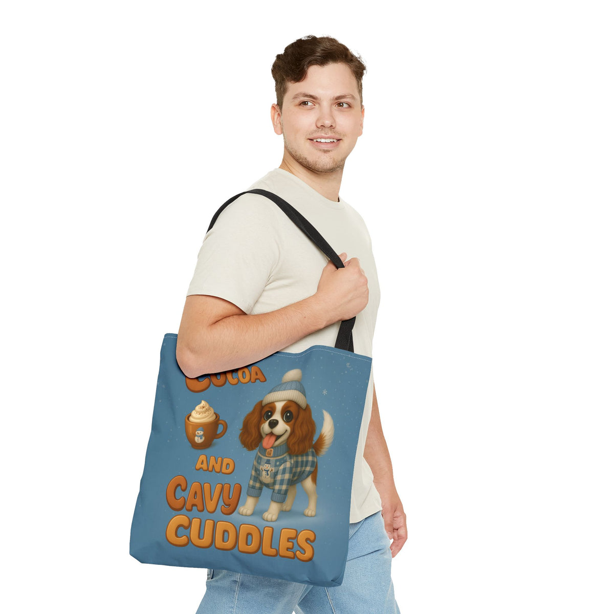 Man carrying the Blenheim Cavalier Cocoa and Cavy Cuddles tote over his shoulder, front view